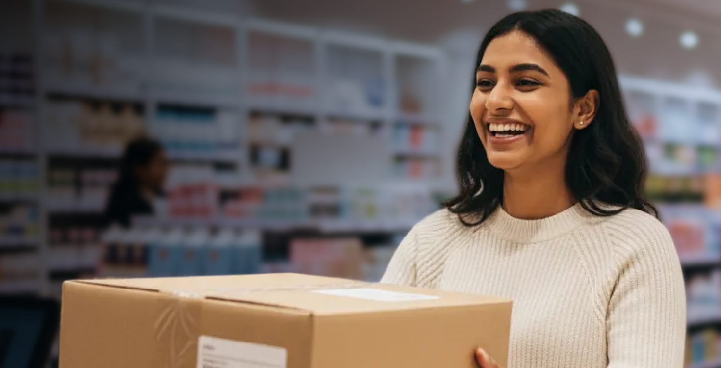 A woman collecting a parcel from an out-of-home collection point.